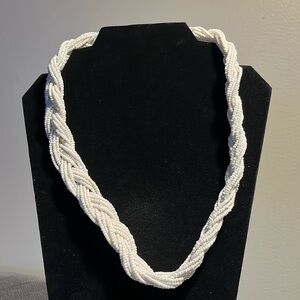 Beaded necklace. White and bright. Small beaded and braided necklace.